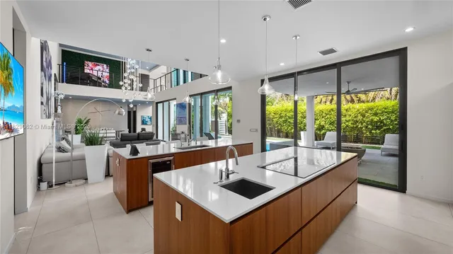 a living room with a bed furniture and a large window