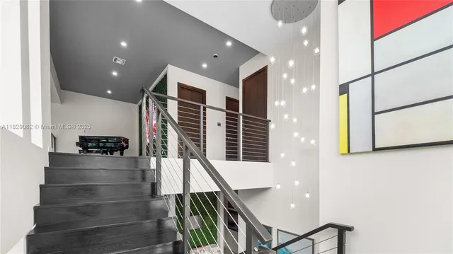 a bathroom with a granite countertop sink a toilet and a mirror