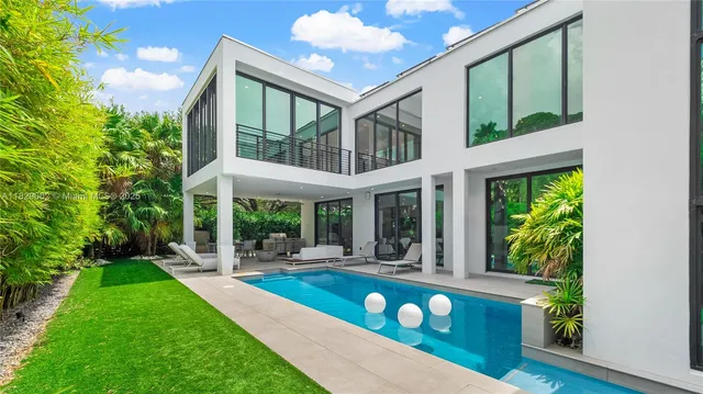 a view of a patio with couches chairs and a potted plant