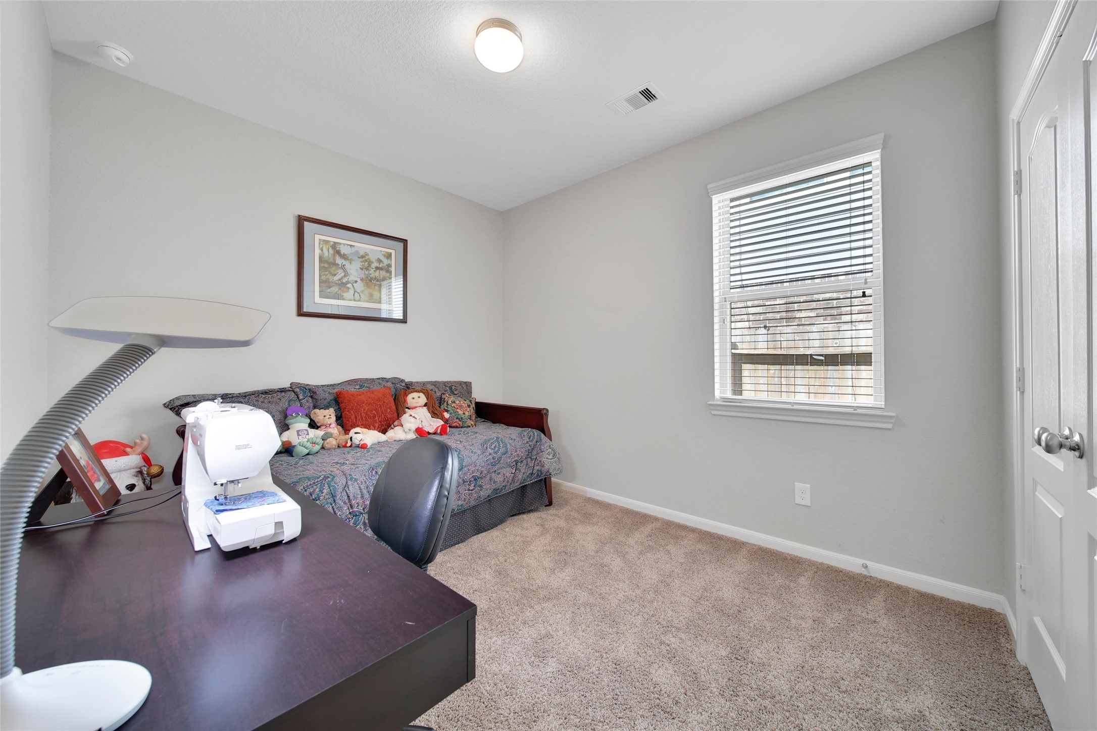 214 Pleasant Hill Way Conroe, TX 77304 - Photo 28 of 43 The third bedroom is located in the middle of the home.