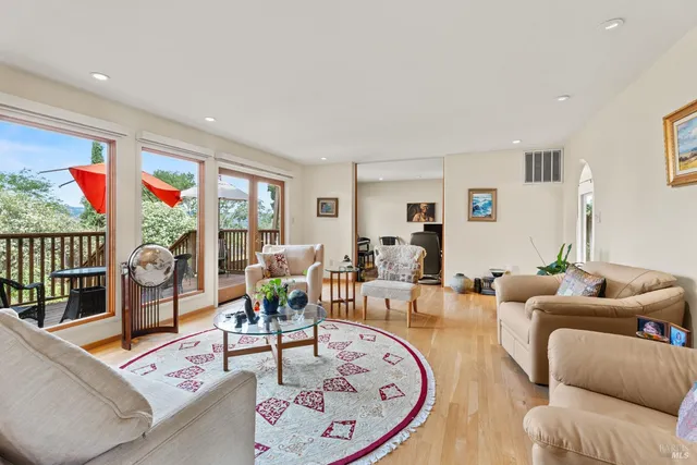 a living room with furniture or couch and a large window