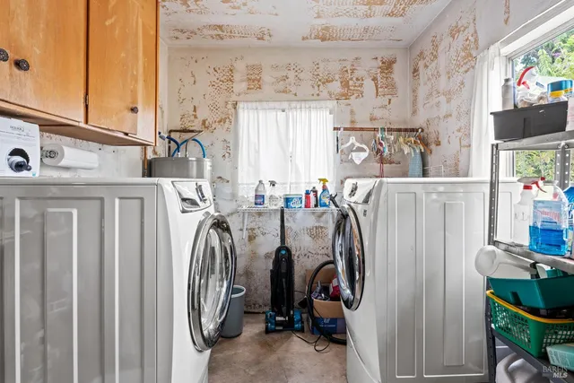 a view of a storage and utility room with a window