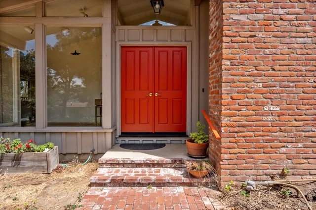 a view of a door and chair of the house