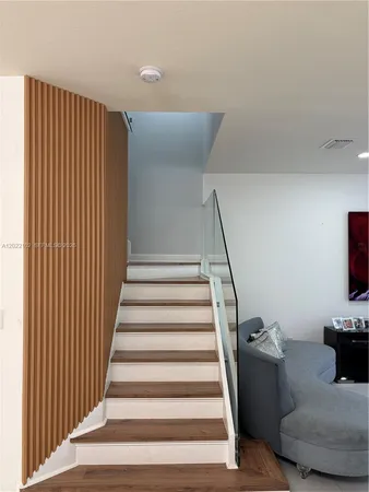 a view of entryway with wooden floor and furniture