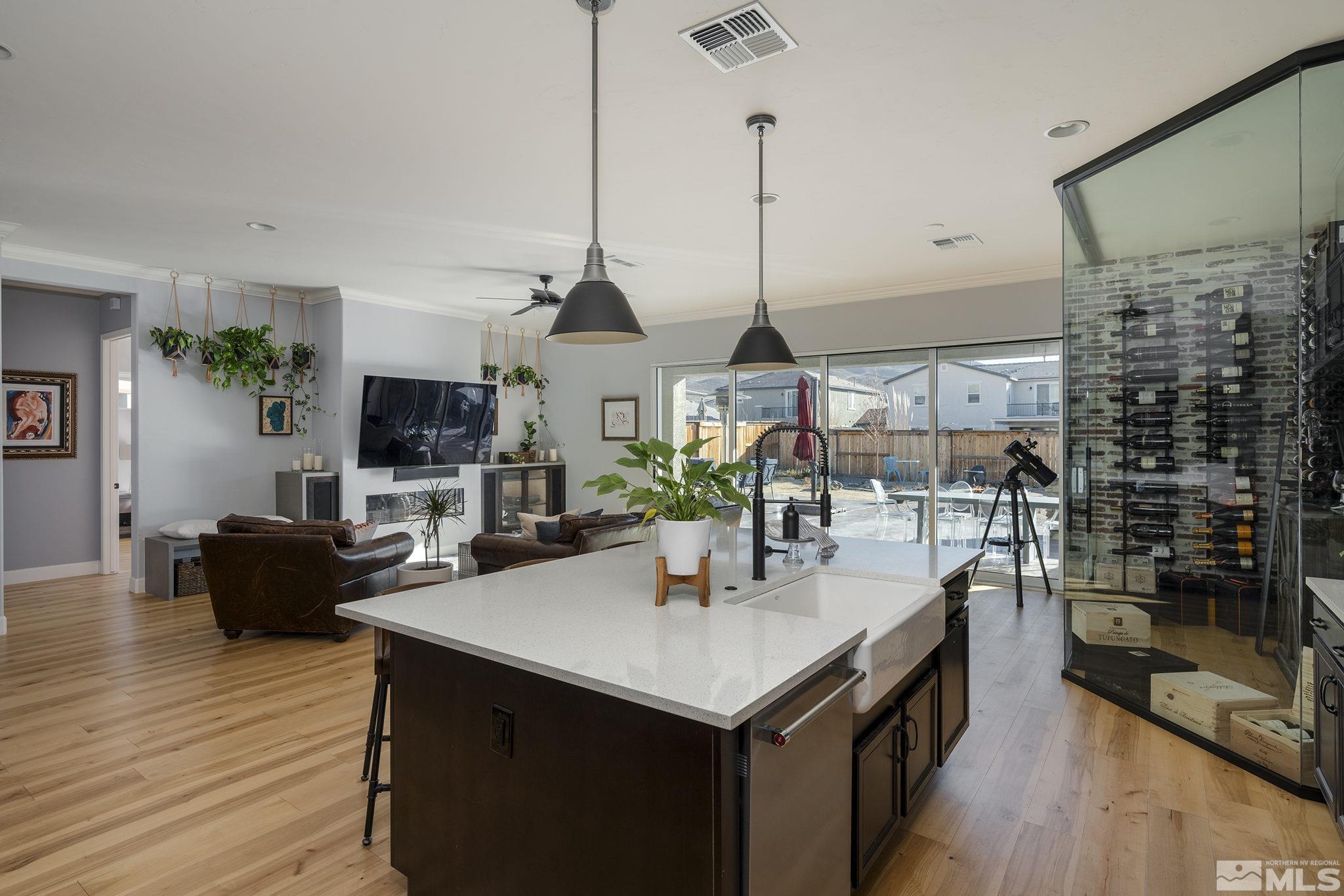 3010 Bonfire Lane Reno, NV 89521 - Photo 12 of 36 a view of center island of a kitchen with a table and chairs