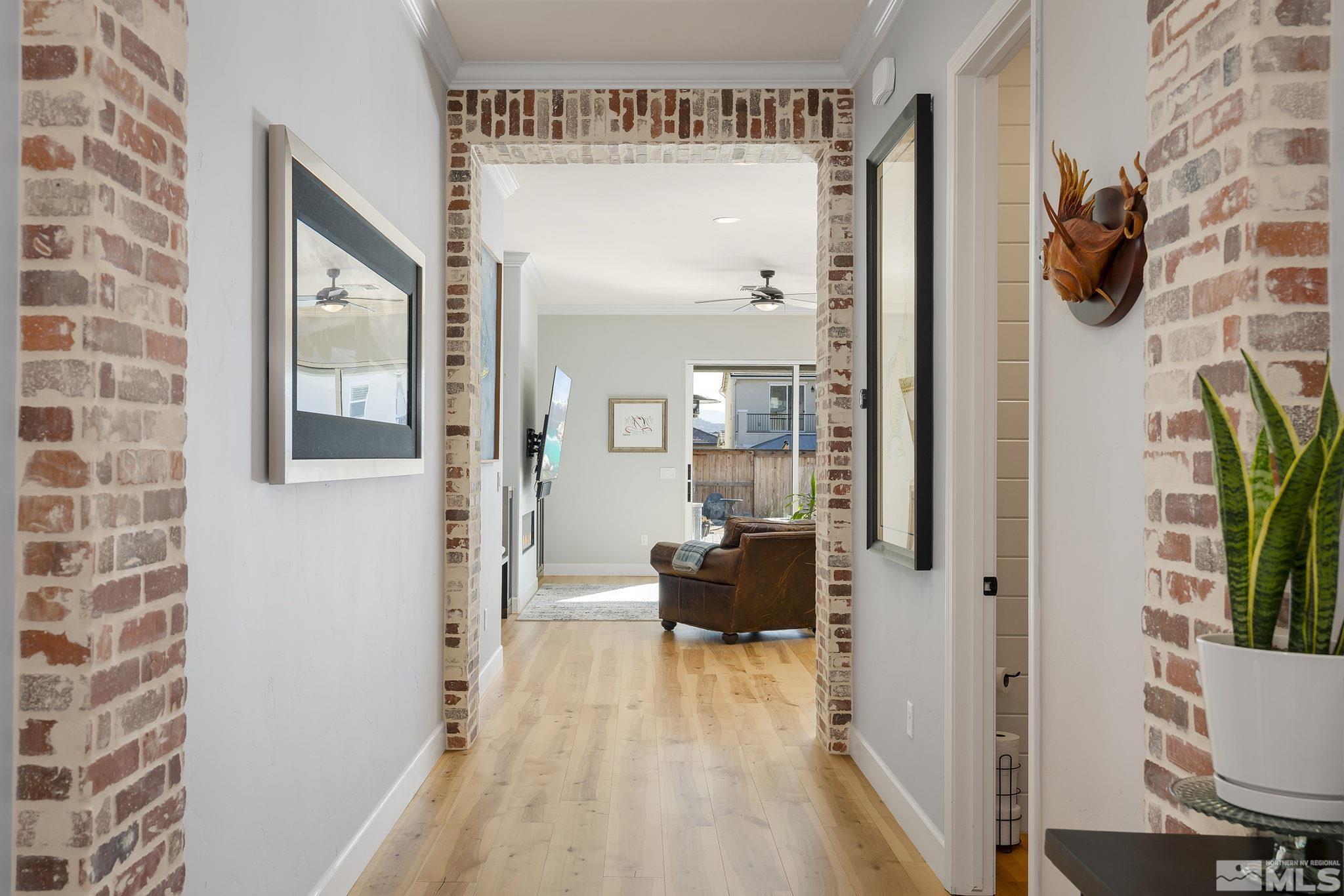 3010 Bonfire Lane Reno, NV 89521 - Photo 3 of 36 a view of a hallway with wooden floor and a living room