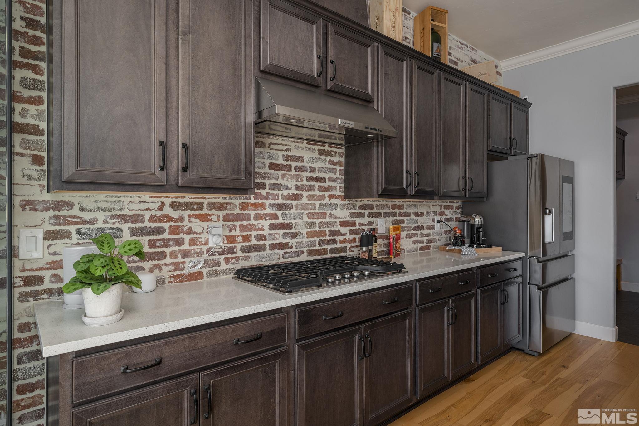 3010 Bonfire Lane Reno, NV 89521 - Photo 10 of 36 a kitchen with stainless steel appliances granite countertop a sink stove and refrigerator