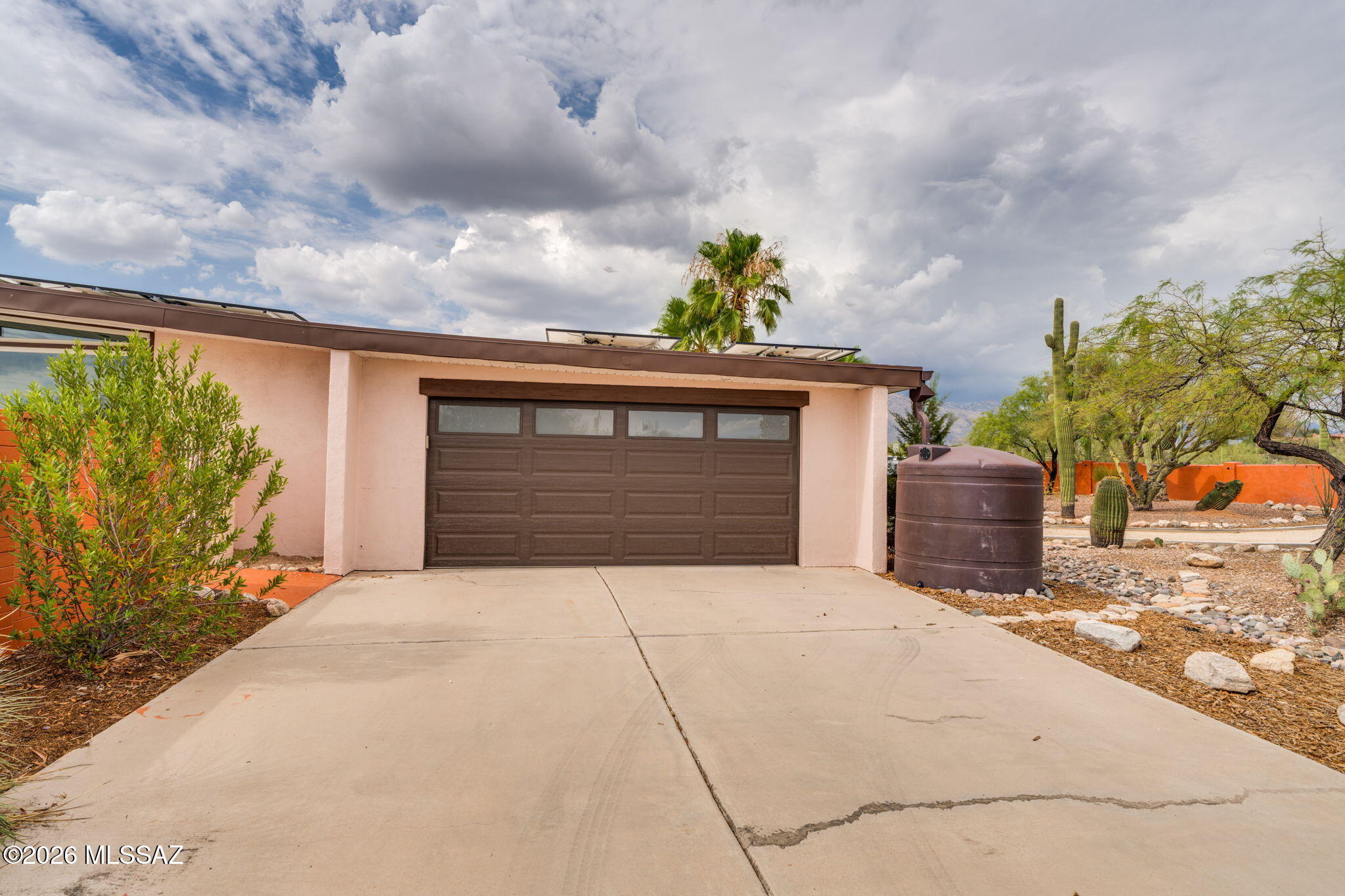 4425 North Pontatoc Road Tucson, AZ 85718 - Photo 44 of 47 Garage and one of the two rainwater collection tanks