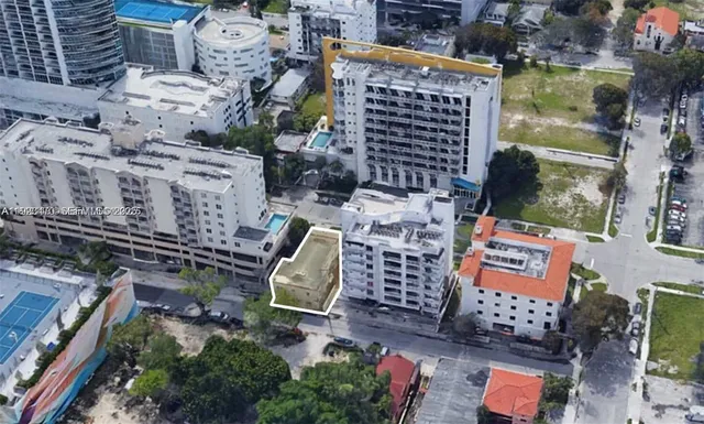 an aerial view of a brick building with many windows