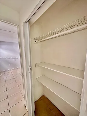 a view of an empty walk in closet