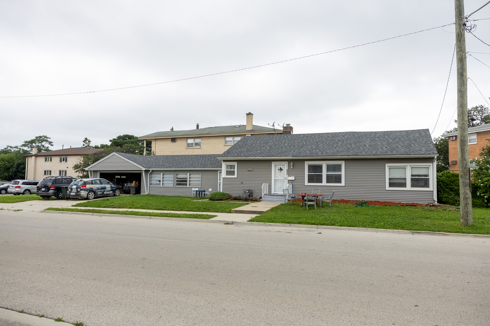 4422 Custer Avenue Brookfield, IL 60513 - Photo 1 of 22 a front view of house with yard and green space