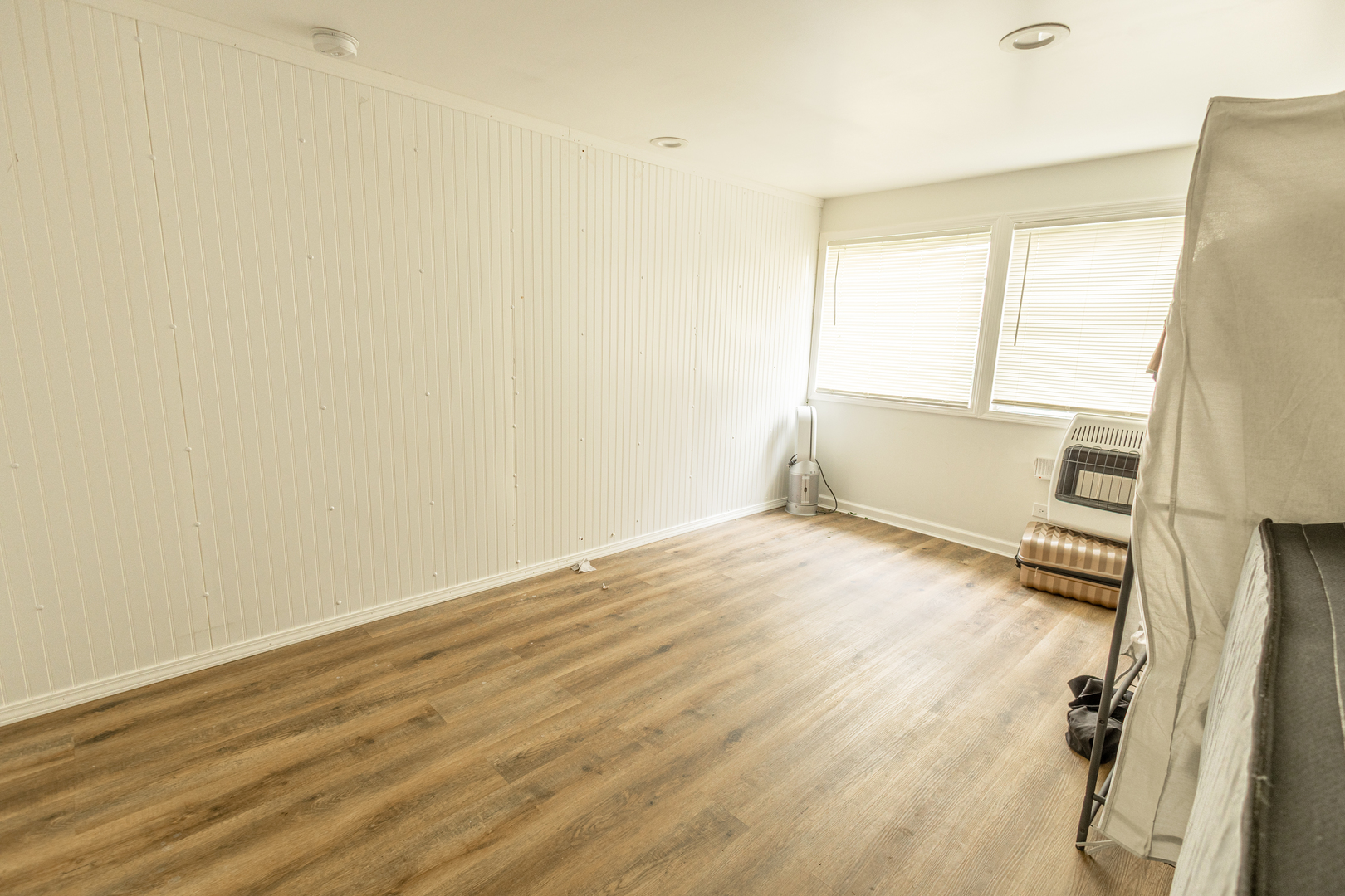 4422 Custer Avenue Brookfield, IL 60513 - Photo 11 of 22 an empty room with wooden floor and windows
