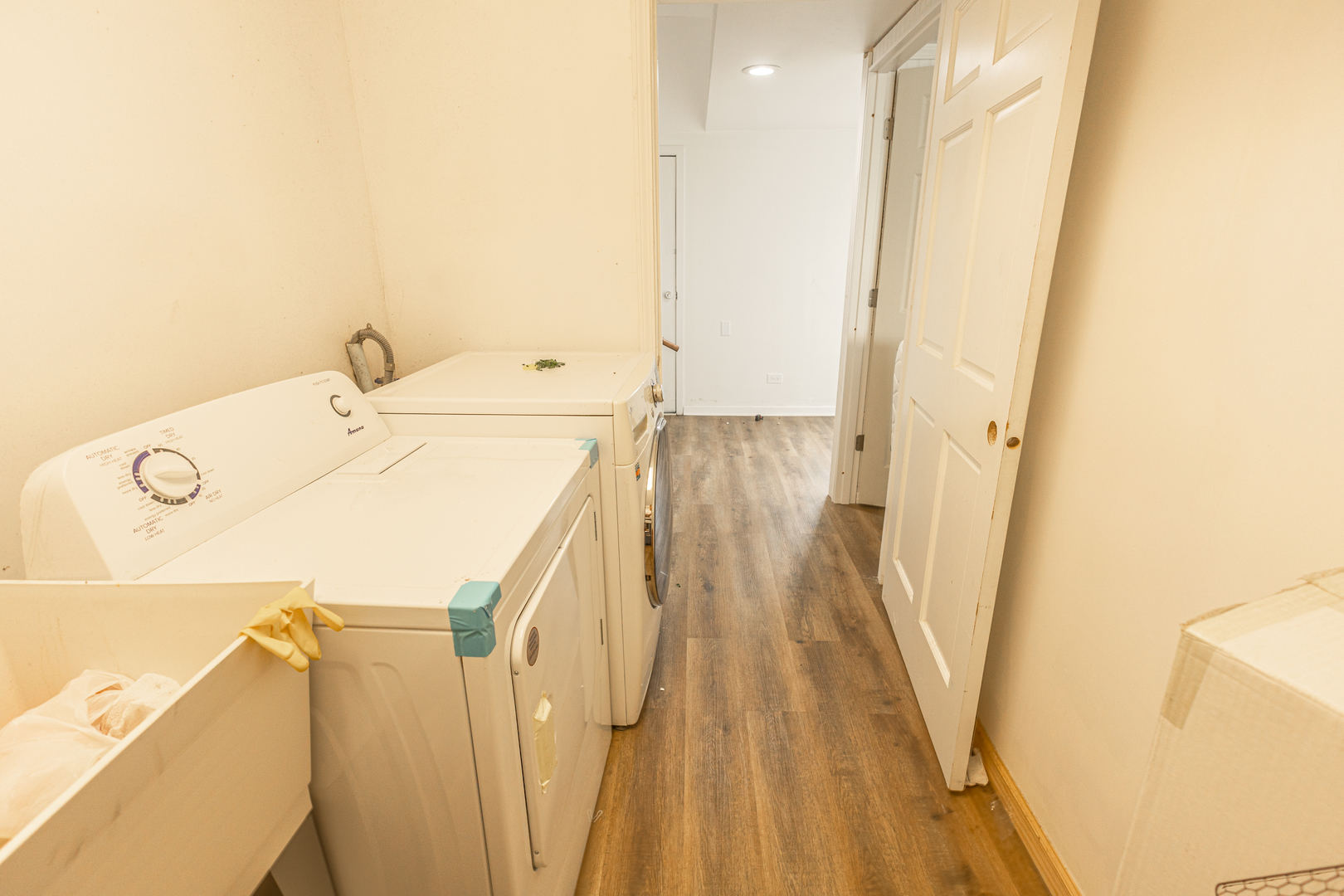 4422 Custer Avenue Brookfield, IL 60513 - Photo 12 of 22 a utility room with a sink a wooden floor and entryway