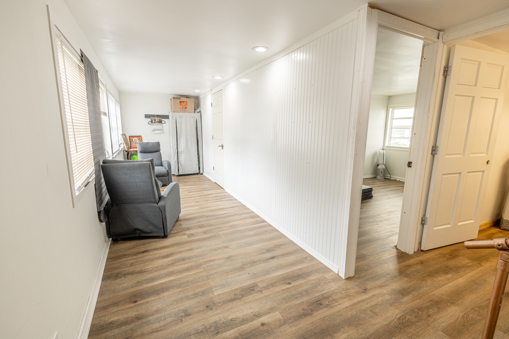 4422 Custer Avenue Brookfield, IL 60513 - Photo 13 of 22 a view of a hallway with wooden floor and furniture