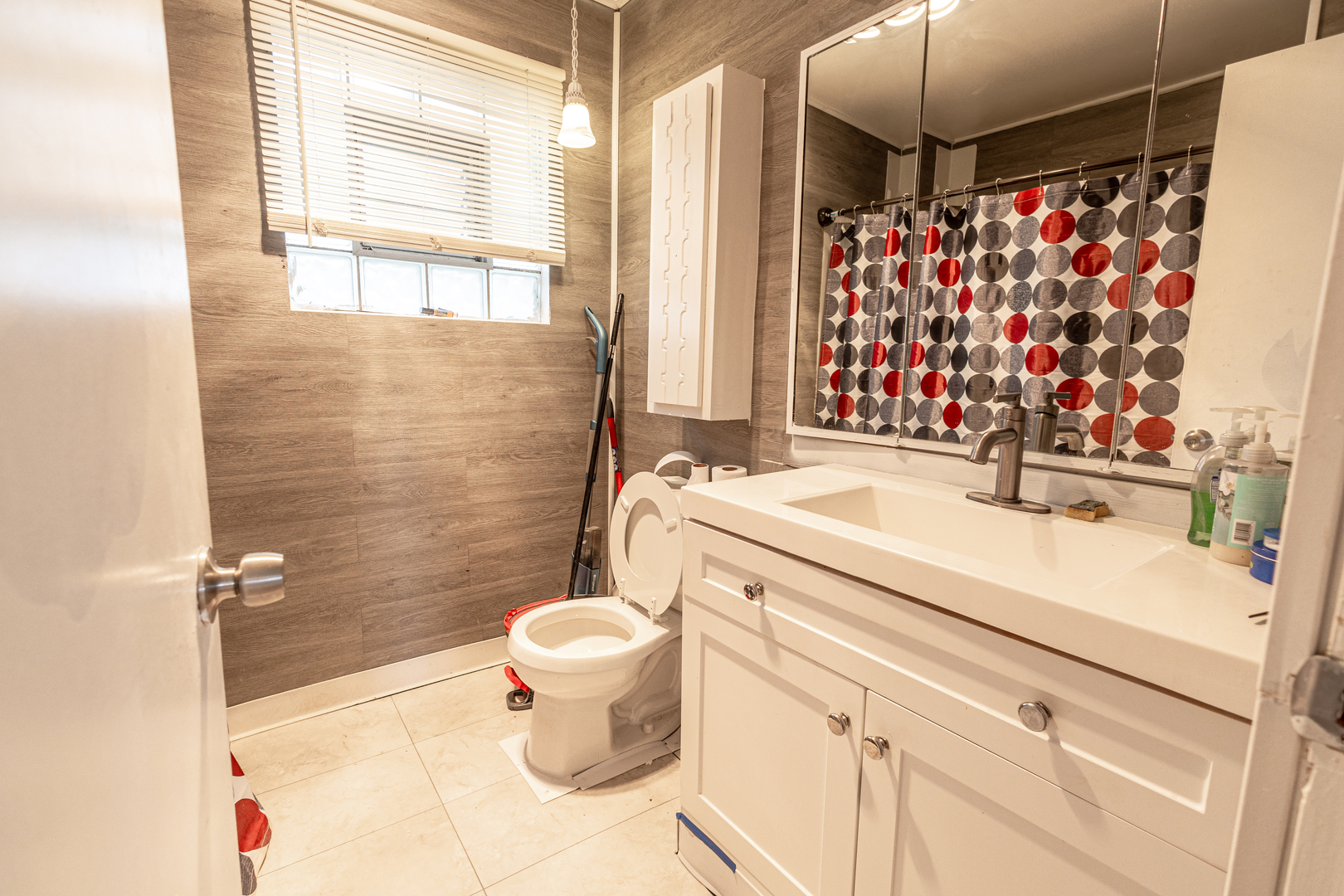 4422 Custer Avenue Brookfield, IL 60513 - Photo 17 of 22 a bathroom with a sink toilet and shower