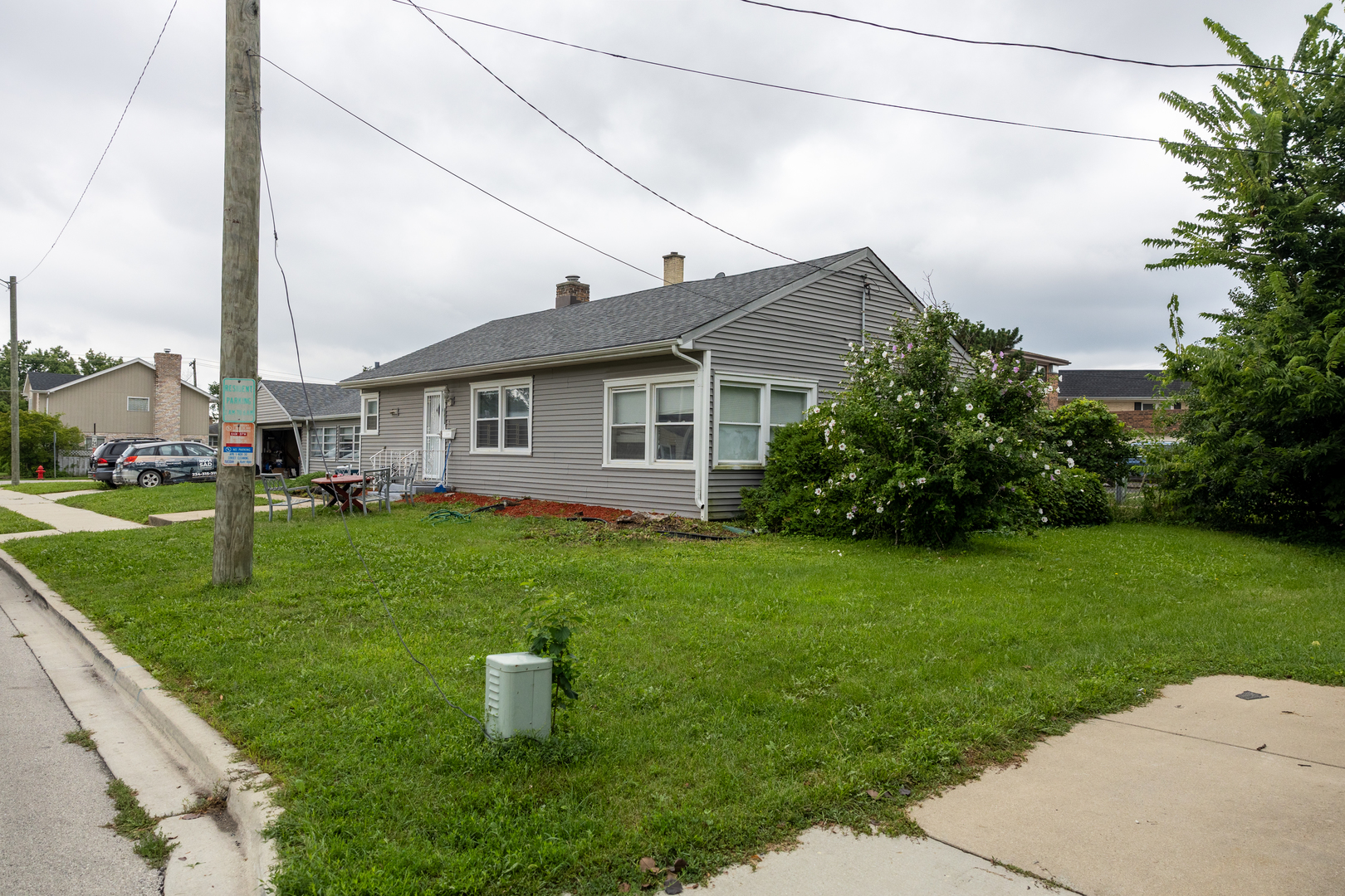 4422 Custer Avenue Brookfield, IL 60513 - Photo 19 of 22 a front view of a house with a garden