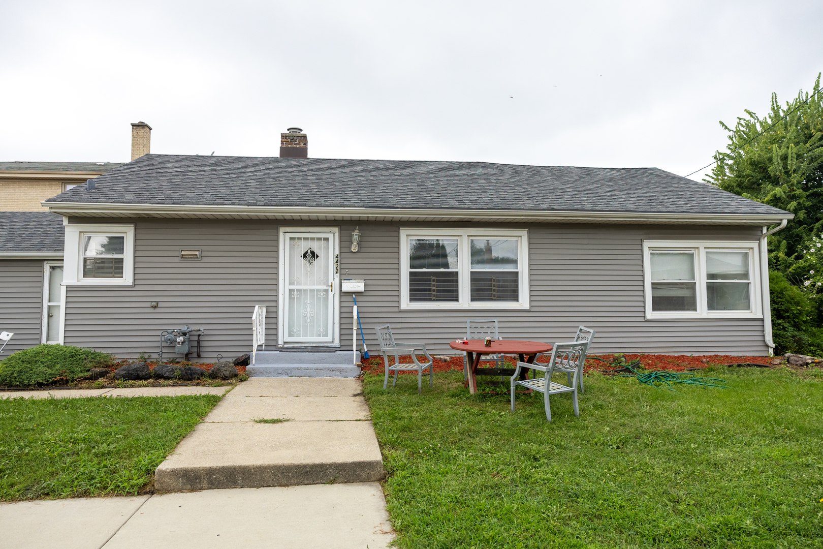 4422 Custer Avenue Brookfield, IL 60513 - Photo 2 of 22 a front view of house with a garden