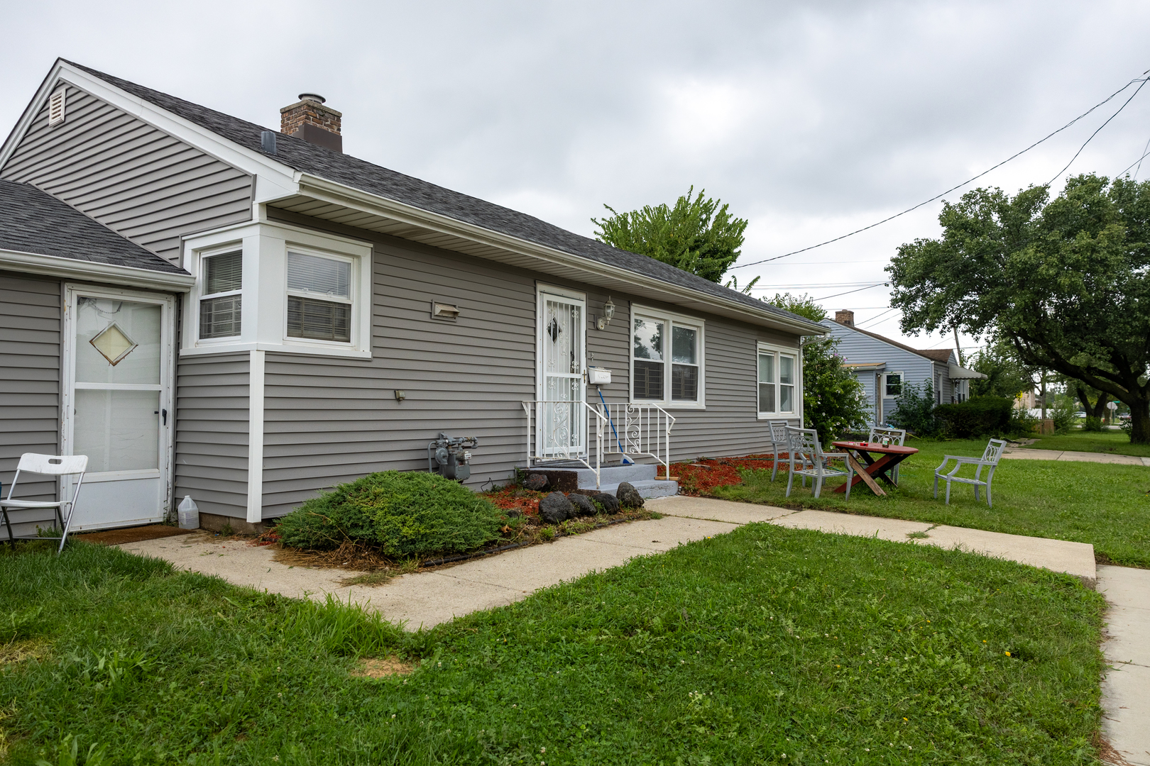 4422 Custer Avenue Brookfield, IL 60513 - Photo 22 of 22 a front view of house with yard and outdoor seating