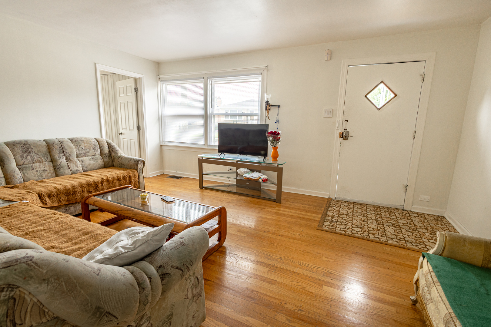 4422 Custer Avenue Brookfield, IL 60513 - Photo 5 of 22 a living room with furniture and a flat screen tv