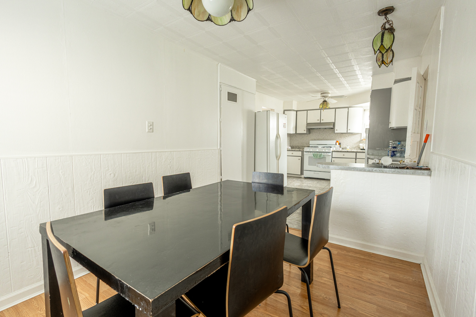 4422 Custer Avenue Brookfield, IL 60513 - Photo 7 of 22 a view of a dining room with furniture and wooden floor