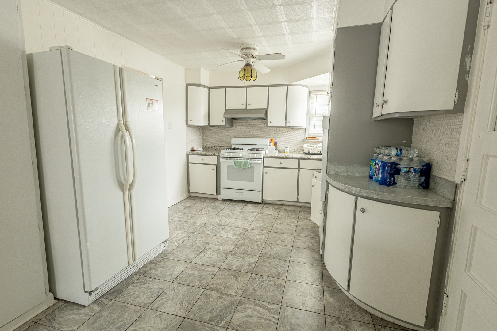 4422 Custer Avenue Brookfield, IL 60513 - Photo 10 of 22 a kitchen with stainless steel appliances granite countertop a refrigerator and a stove top oven