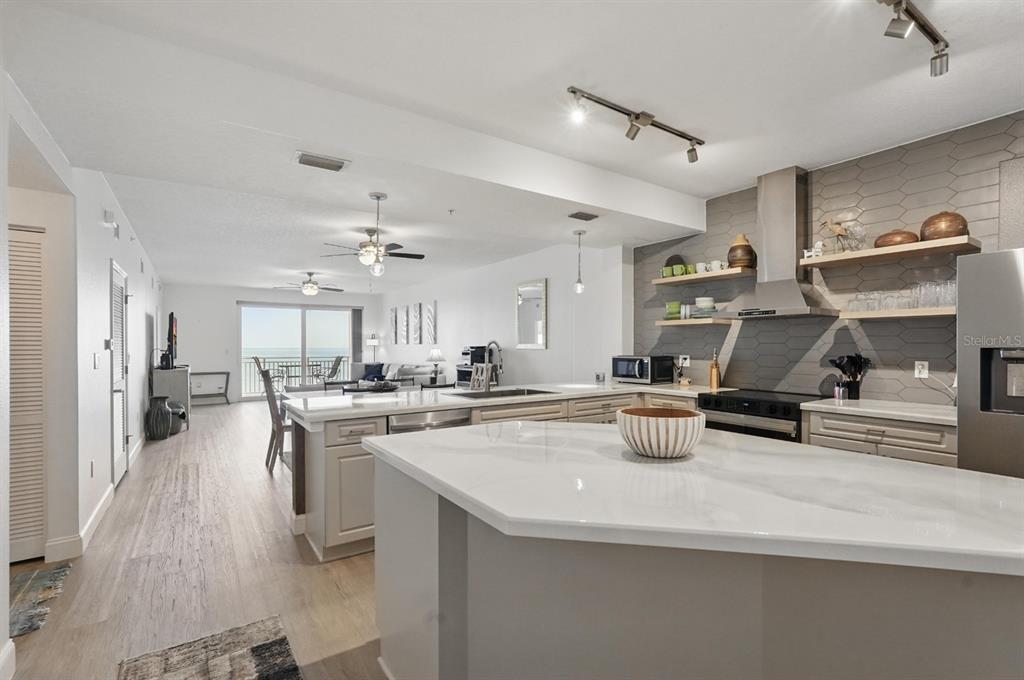 80 Surfview Drive, Unit 511 Palm Coast, FL 32137 - Photo 2 of 25 a kitchen with sink a stove and cabinets