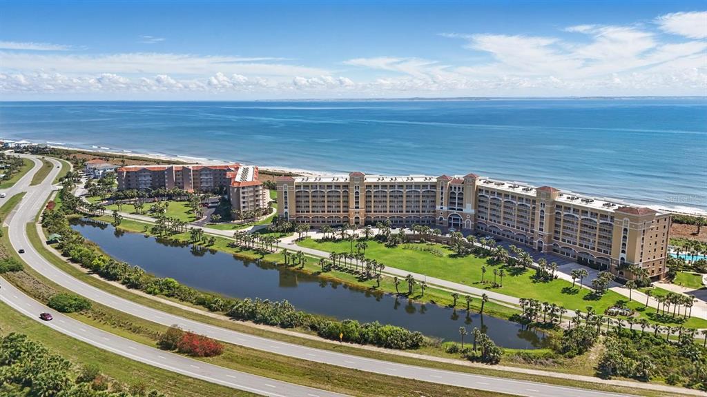 80 Surfview Drive, Unit 511 Palm Coast, FL 32137 - Photo 21 of 25 a view of a swimming pool with an outdoor space