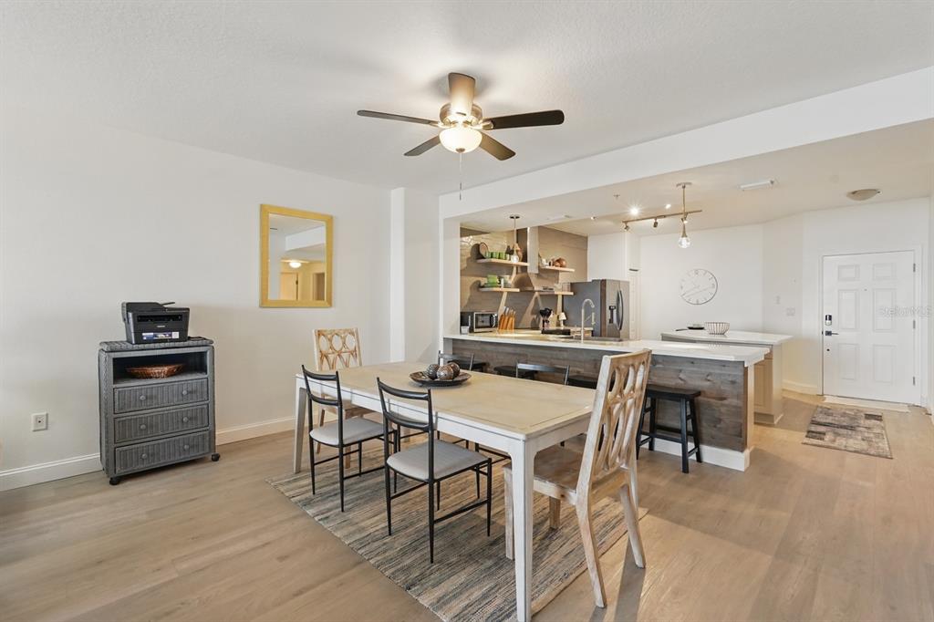 80 Surfview Drive, Unit 511 Palm Coast, FL 32137 - Photo 5 of 25 a view of a dining room with furniture and a chandelier