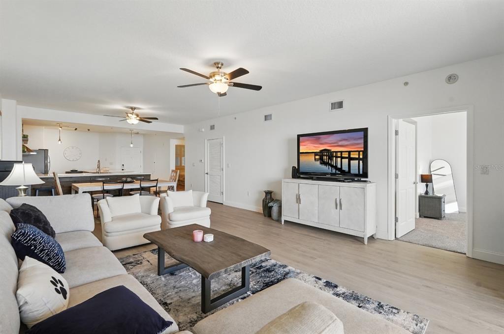 80 Surfview Drive, Unit 511 Palm Coast, FL 32137 - Photo 8 of 25 a living room with furniture and a flat screen tv