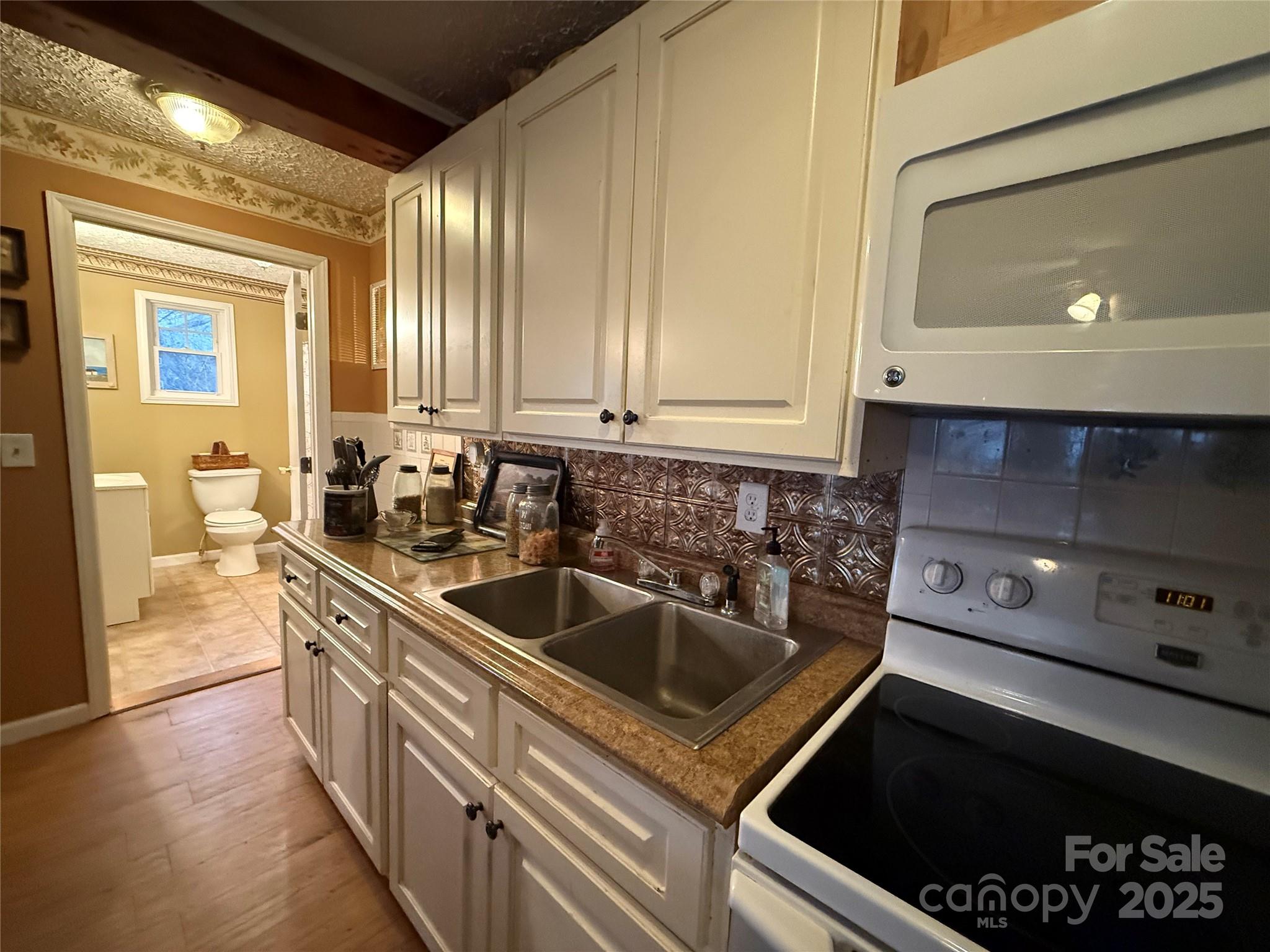 201 Mountain Vista Road Canton, NC 28716 - Photo 5 of 21 a kitchen that has a sink and a stove