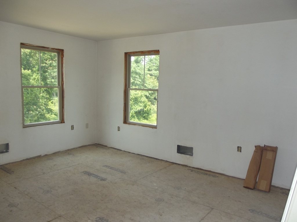 123 Willard Road Ashburnham, MA 01430 - Photo 14 of 15 a view of an empty room with a window