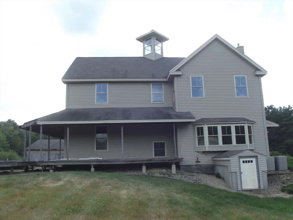123 Willard Road Ashburnham, MA 01430 - Photo 3 of 15 a front view of a house with a garden and yard