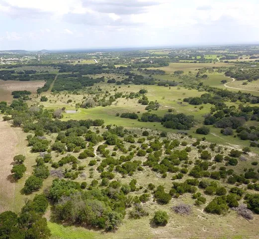 a view of a dry yard covered with snow