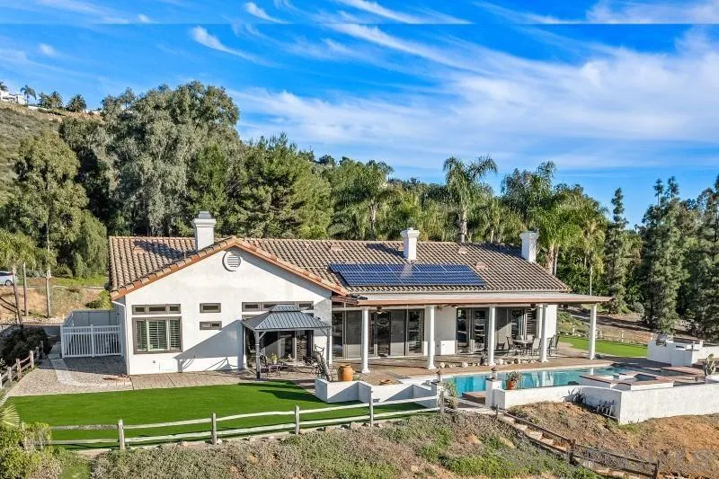 14370 Harvest Crescent Poway, CA 92064 - Photo 12 of 56 a view of a big house with a big yard and large trees