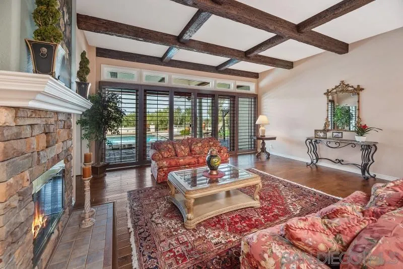 14370 Harvest Crescent Poway, CA 92064 - Photo 16 of 56 a living room with fireplace furniture and floor to ceiling window