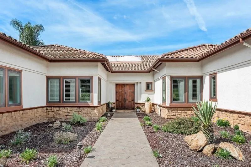 14370 Harvest Crescent Poway, CA 92064 - Photo 2 of 56 a front view of a house with a garden