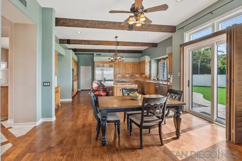 14370 Harvest Crescent Poway, CA 92064 - Photo 26 of 56 a view of a dining room with furniture window and wooden floor