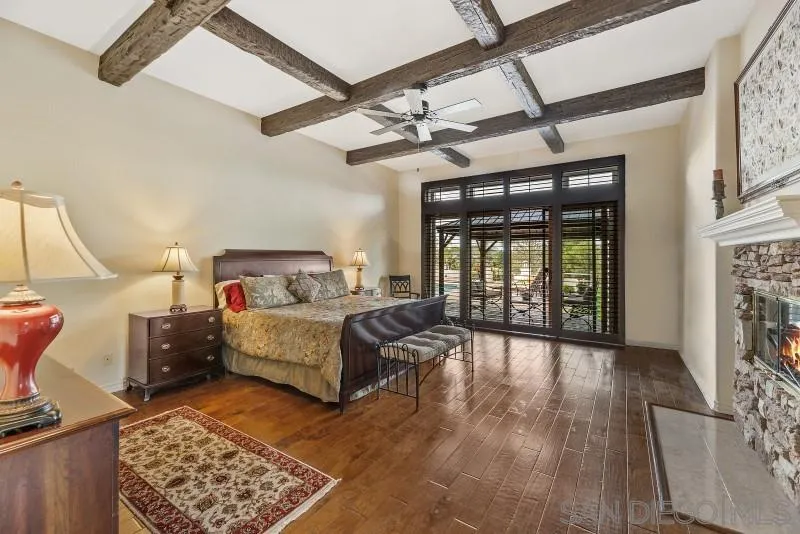 14370 Harvest Crescent Poway, CA 92064 - Photo 30 of 56 a bedroom with a bed and wooden floor