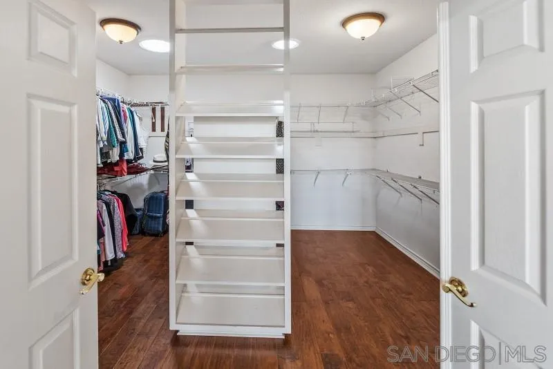 14370 Harvest Crescent Poway, CA 92064 - Photo 35 of 56 a view of walk in closet with empty racks