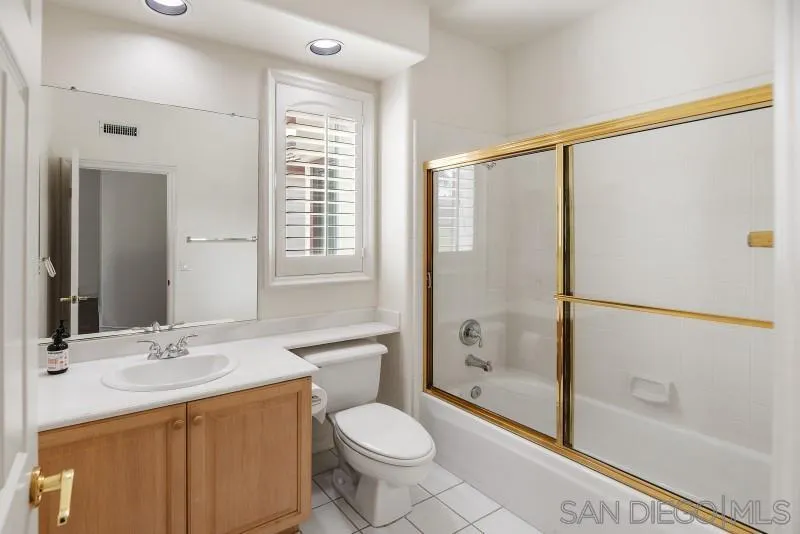 14370 Harvest Crescent Poway, CA 92064 - Photo 44 of 56 a bathroom with a granite countertop sink toilet and shower