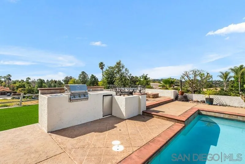 14370 Harvest Crescent Poway, CA 92064 - Photo 48 of 56 a view of a swimming pool with a lounge chair