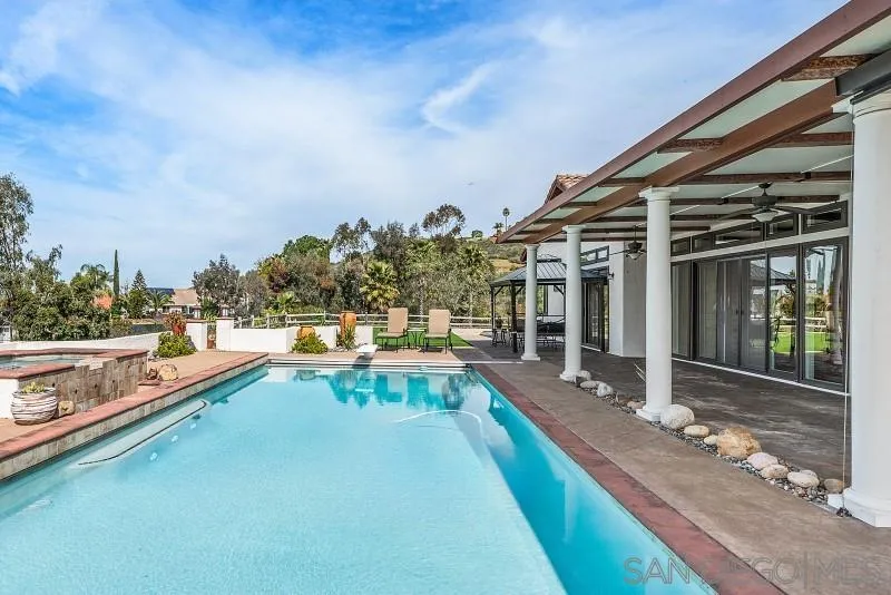 14370 Harvest Crescent Poway, CA 92064 - Photo 49 of 56 a view of a swimming pool with a lounge chairs