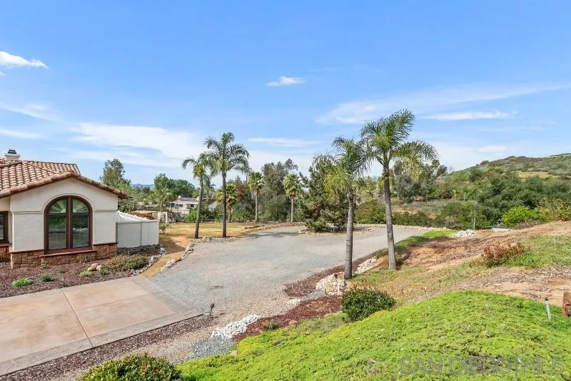 14370 Harvest Crescent Poway, CA 92064 - Photo 56 of 56 a view of a house with a yard and potted plants