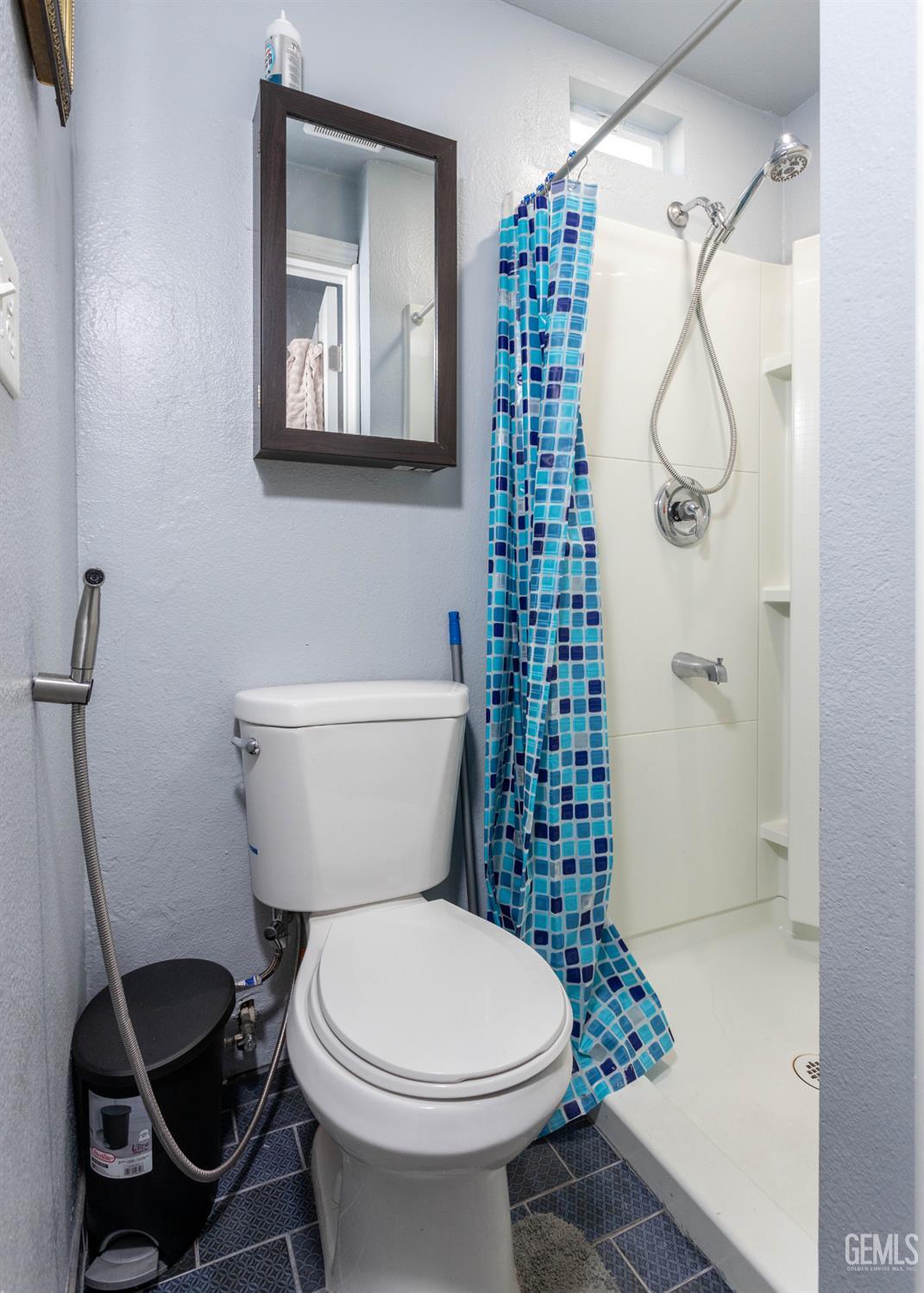 Undisclosed Address Delano, CA 93215 - Photo 16 of 35 a bathroom with a toilet and a shower