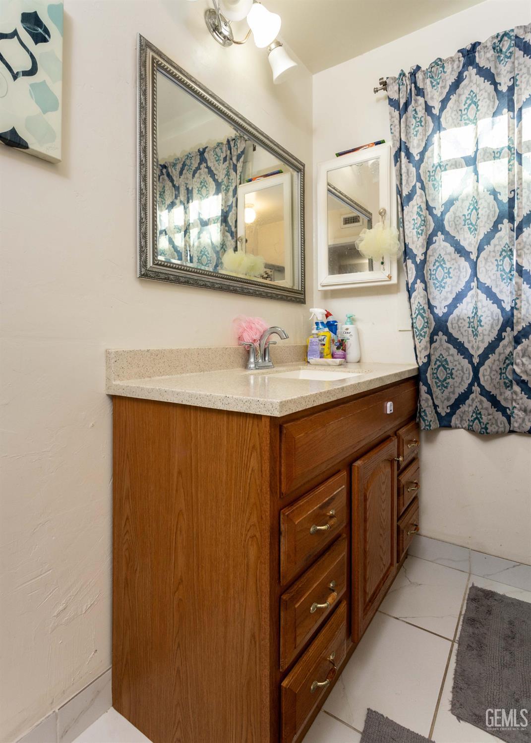 Undisclosed Address Delano, CA 93215 - Photo 20 of 35 a bathroom with a sink and a mirror