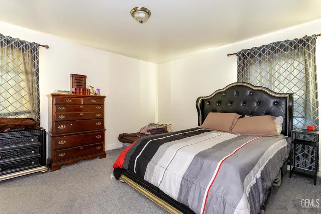 a bedroom with a bed and a closet