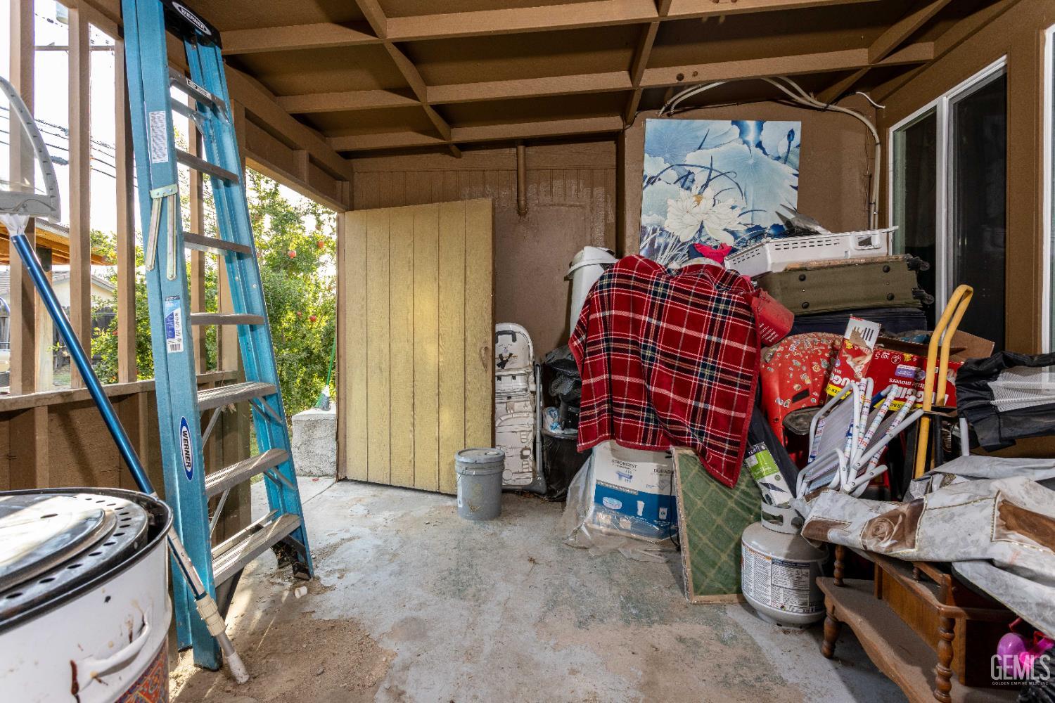 Undisclosed Address Delano, CA 93215 - Photo 27 of 35 a bedroom with a bed and a window