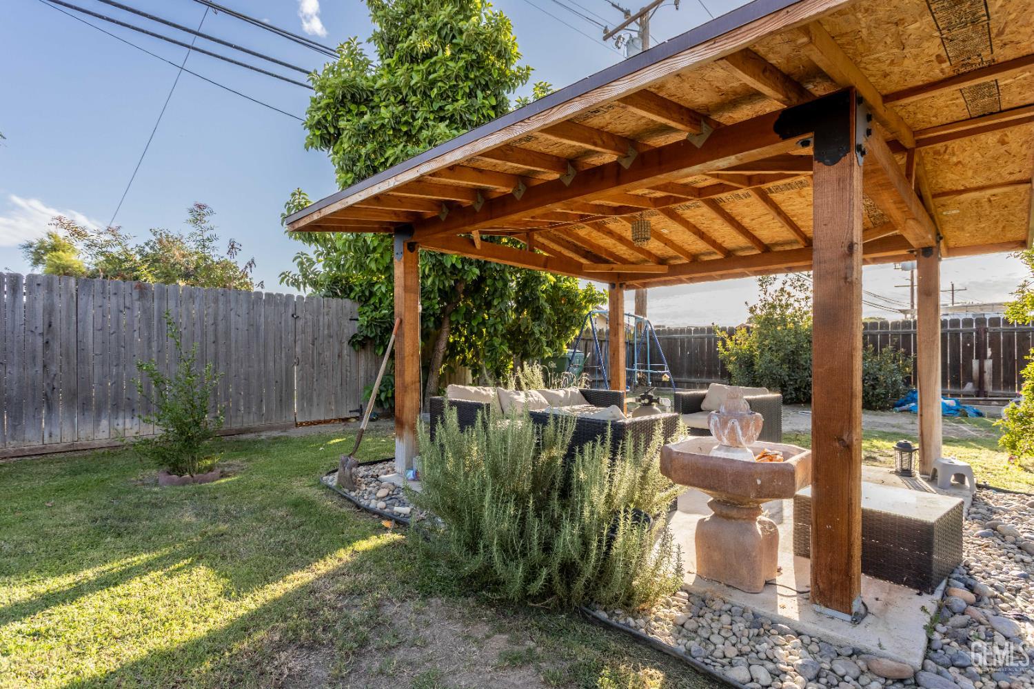 Undisclosed Address Delano, CA 93215 - Photo 34 of 35 a view of backyard with swimming pool and outdoor seating