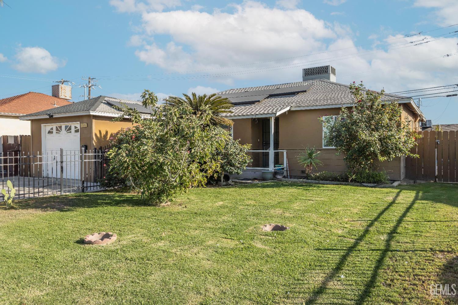 Undisclosed Address Delano, CA 93215 - Photo 6 of 35 a front view of house with yard