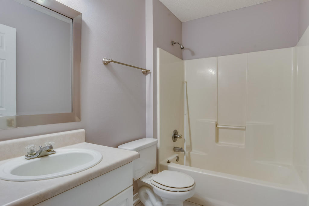 1969 Jessica Way Navarre, FL 32566 - Photo 11 of 17 a bathroom with a sink toilet and shower